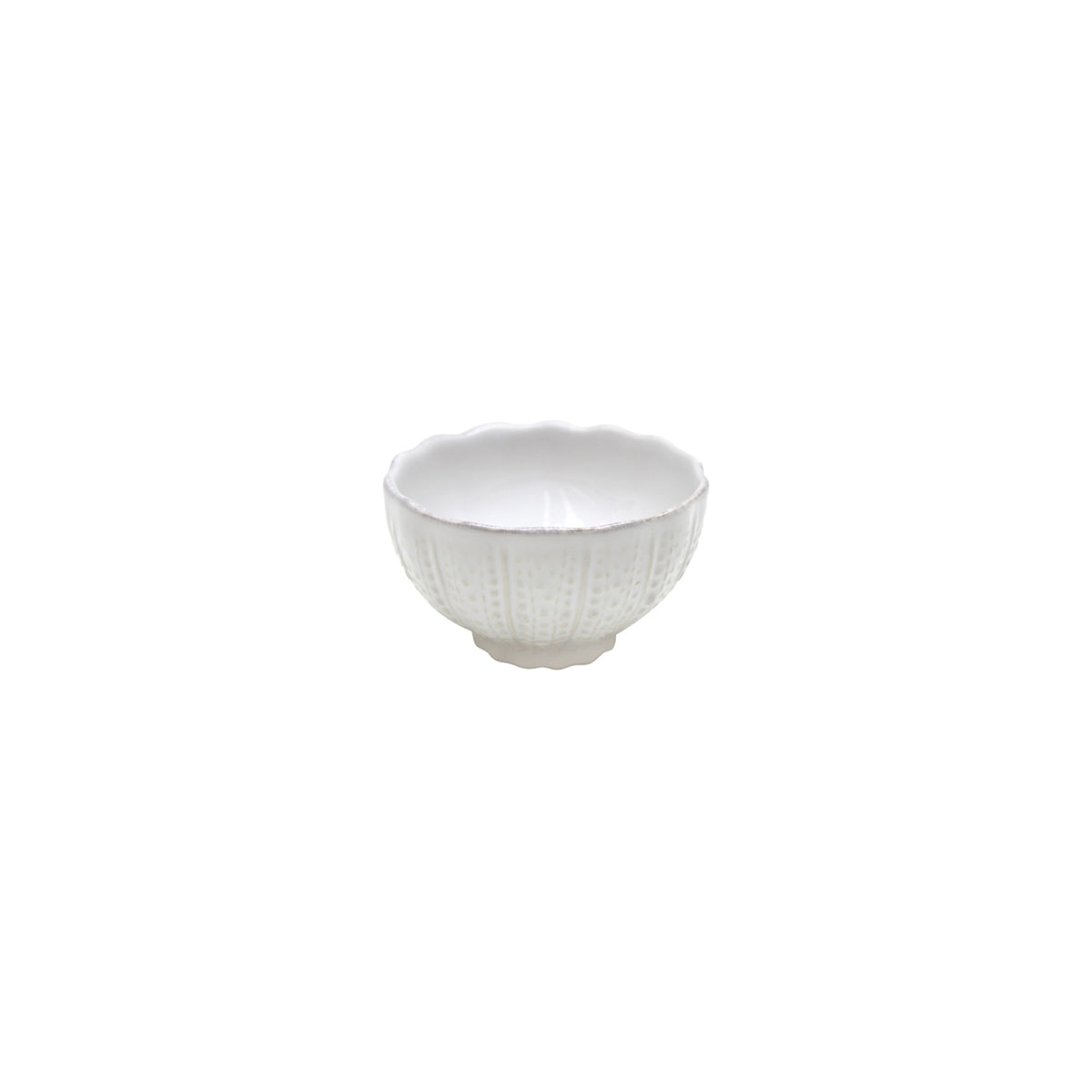 A small white ceramic bowl with a scalloped rim and raised dotted vertical ridges on its exterior sits against a plain white background.